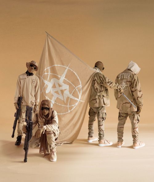 Group of persons holding a KL Company's logo flag